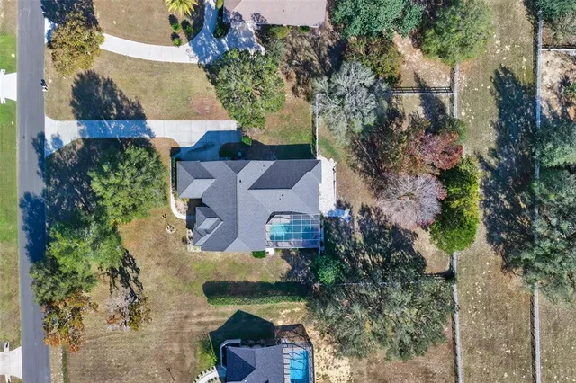 an aerial view of house with yard