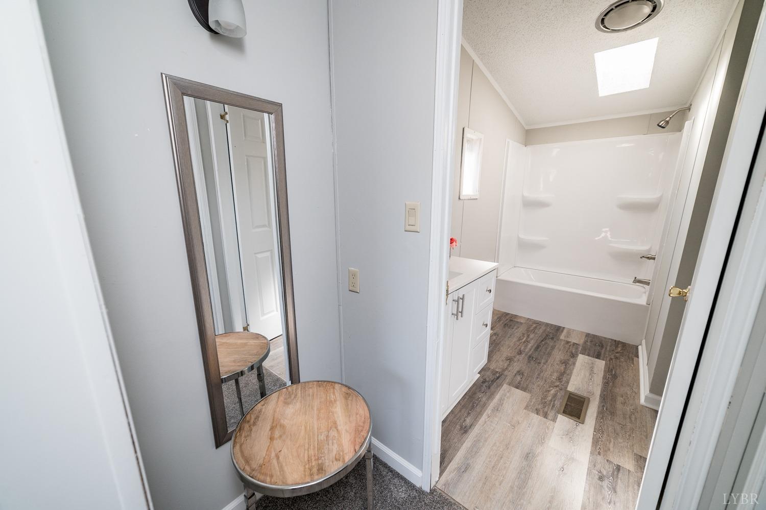 1274 English Tavern Road Rustburg, VA 24588 - Photo 12 of 43 a bathroom with a tub and a toilet