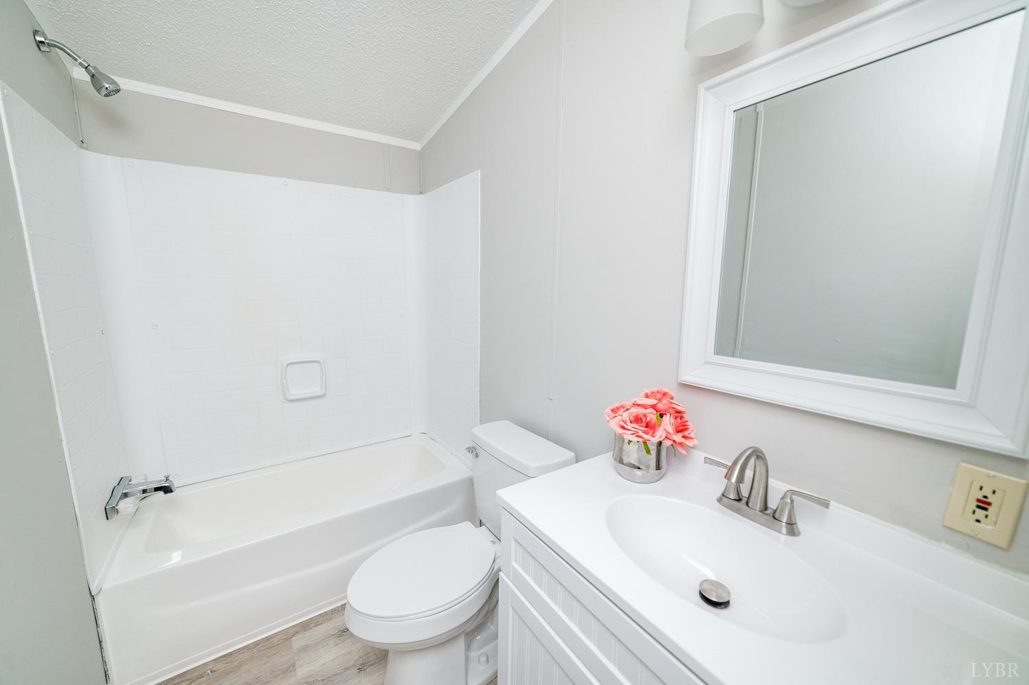 1274 English Tavern Road Rustburg, VA 24588 - Photo 22 of 43 a bathroom with a sink toilet and shower