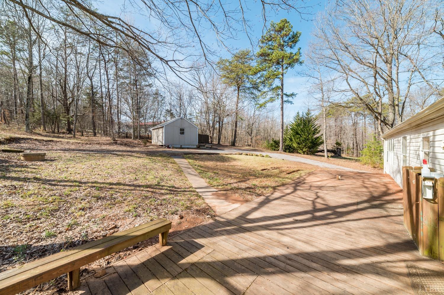 1274 English Tavern Road Rustburg, VA 24588 - Photo 32 of 43 a white house that has a tree in front of it