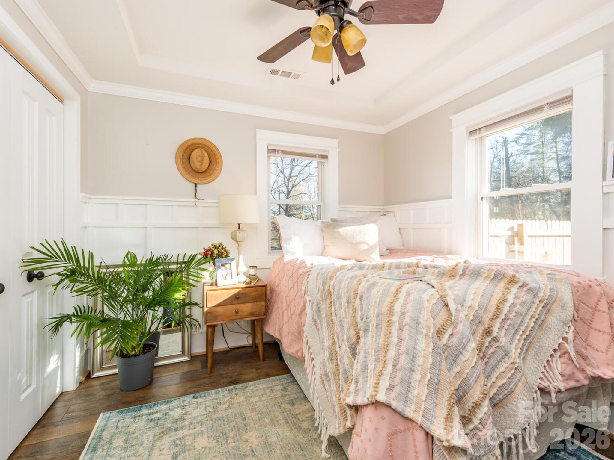 29 White Oak Road Arden, NC 28704 - Photo 13 of 42 a bed sitting in a bedroom next to a window