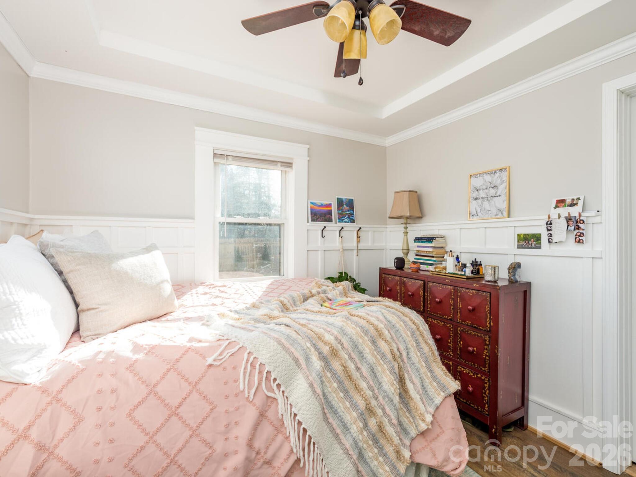 29 White Oak Road Arden, NC 28704 - Photo 14 of 42 a bedroom with a large bed and a chandelier