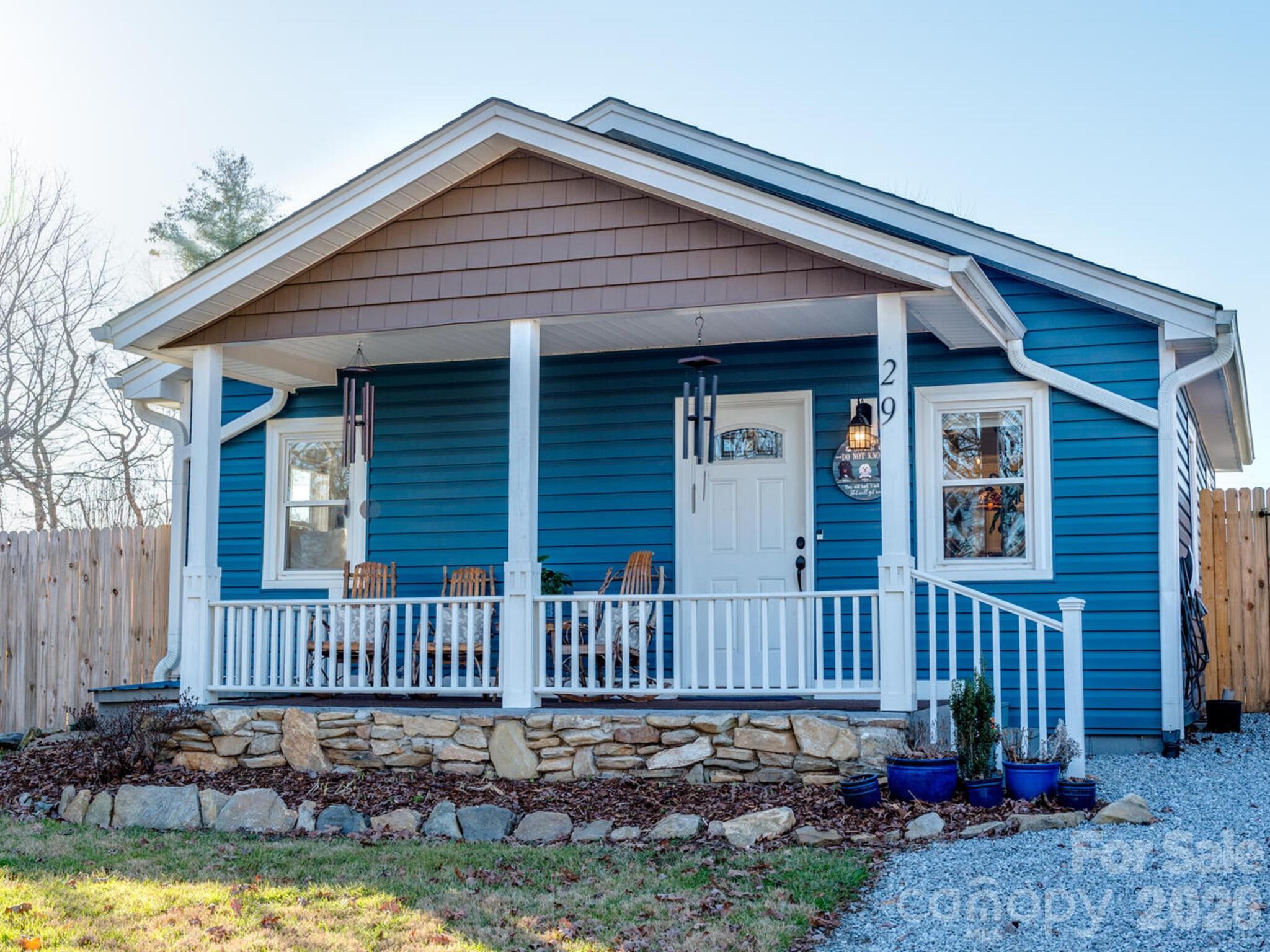 29 White Oak Road Arden, NC 28704 - Photo 35 of 42 a view of a house with a small yard and wooden fence