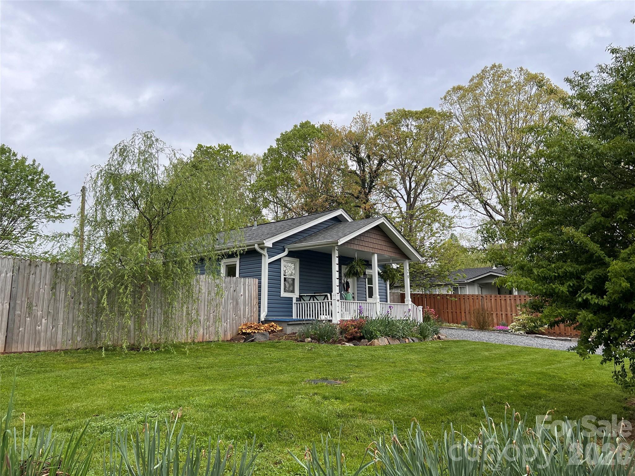 29 White Oak Road Arden, NC 28704 - Photo 42 of 42 a front view of a house with a yard and trees