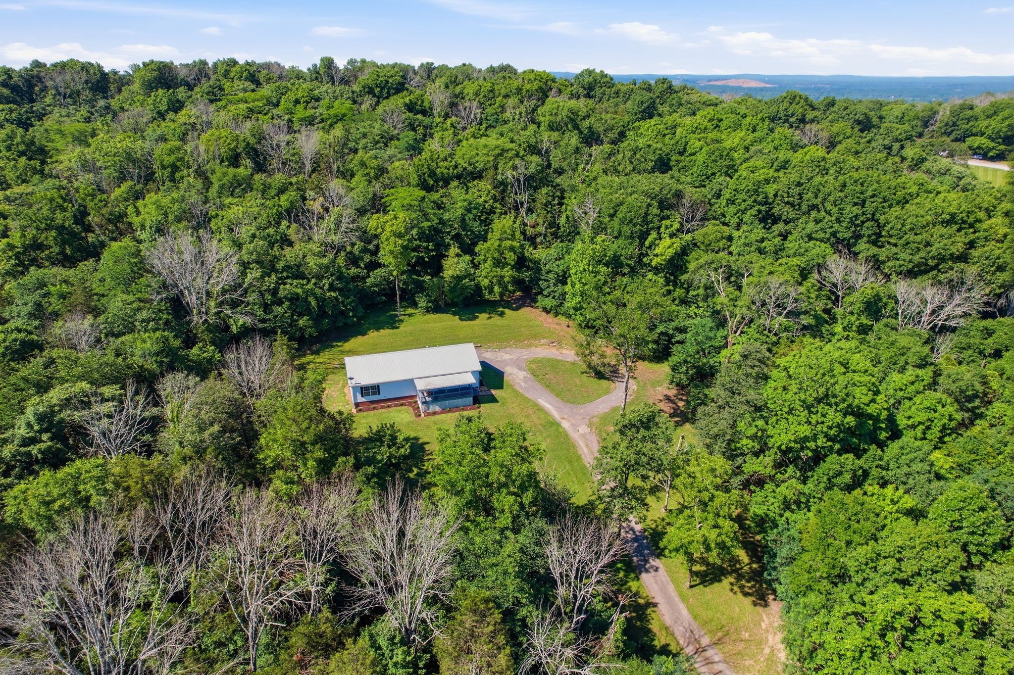 1021 B Jordan Road Lascassas, TN 37085 - Photo 9 of 58 a view of a house with a yard