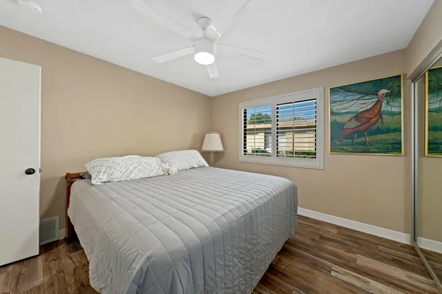 a spacious bathroom with double vanity sink a toilet a bathtub and shower
