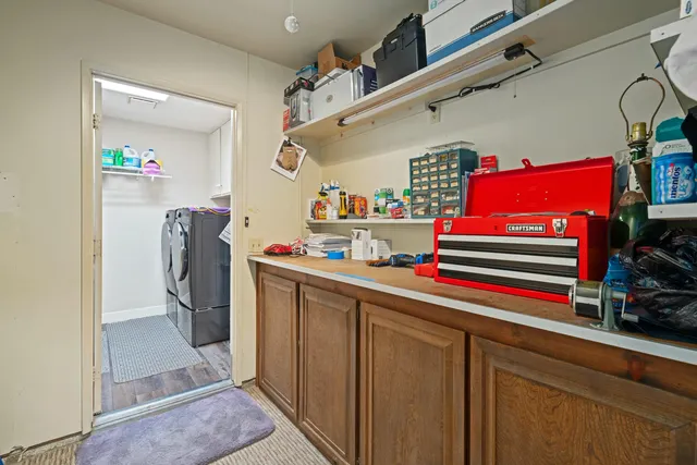 a bedroom with a bed window and flat screen tv