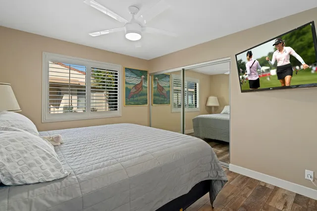 a view of a swimming pool and chairs in patio