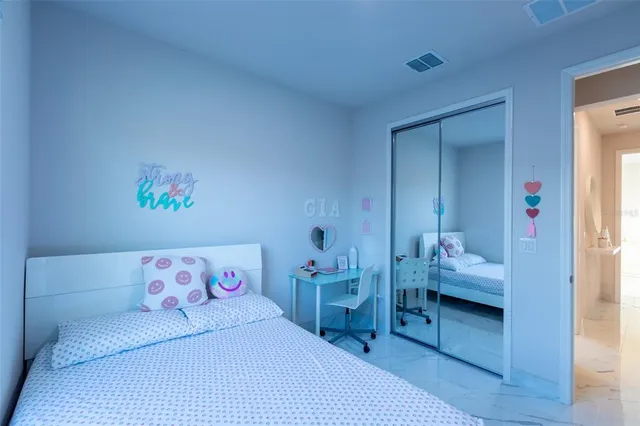 a bedroom with a bed and a cabinets