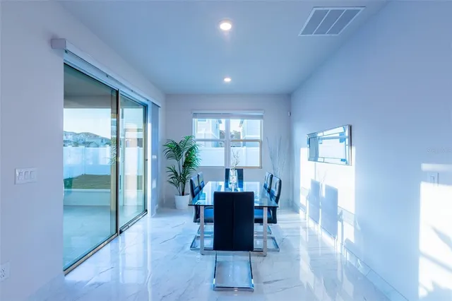 a view of a livingroom with furniture wooden floor and a window