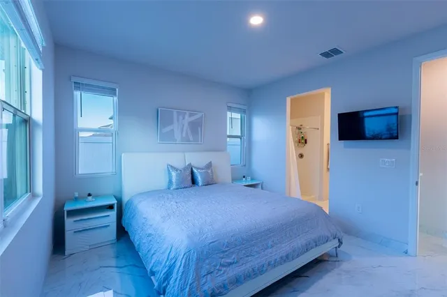 a bedroom with a bed and a closet
