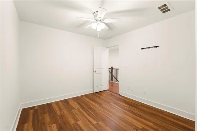 a bathroom with a granite countertop toilet a sink and a bathtub