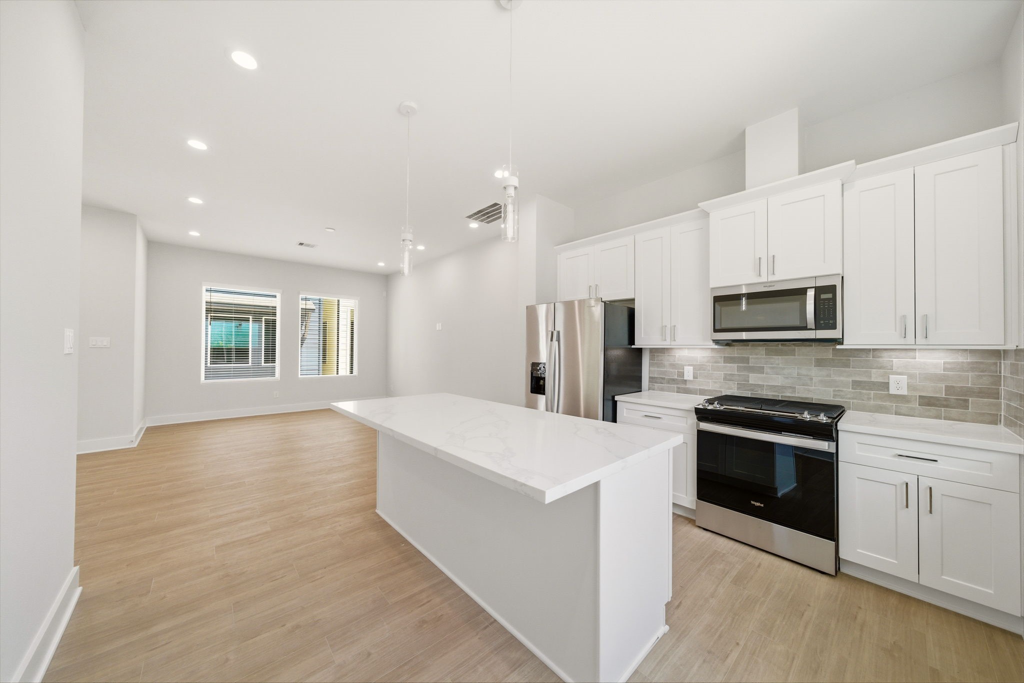 1398 Cedar Post Lane Houston, TX 77080 - Photo 13 of 33 a large kitchen with stainless steel appliances granite countertop a stove a sink and a refrigerator