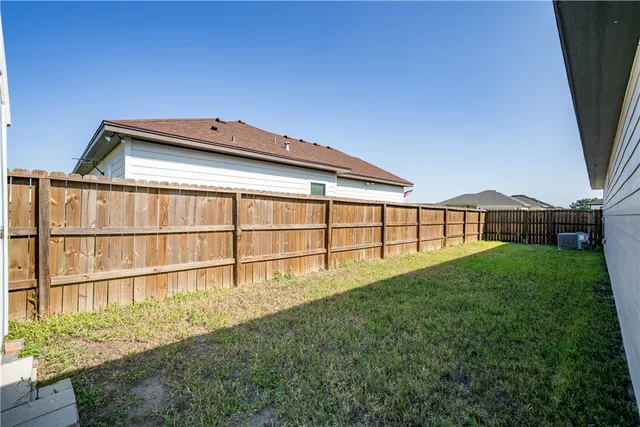 a view of an house with backyard porch and wooden floor