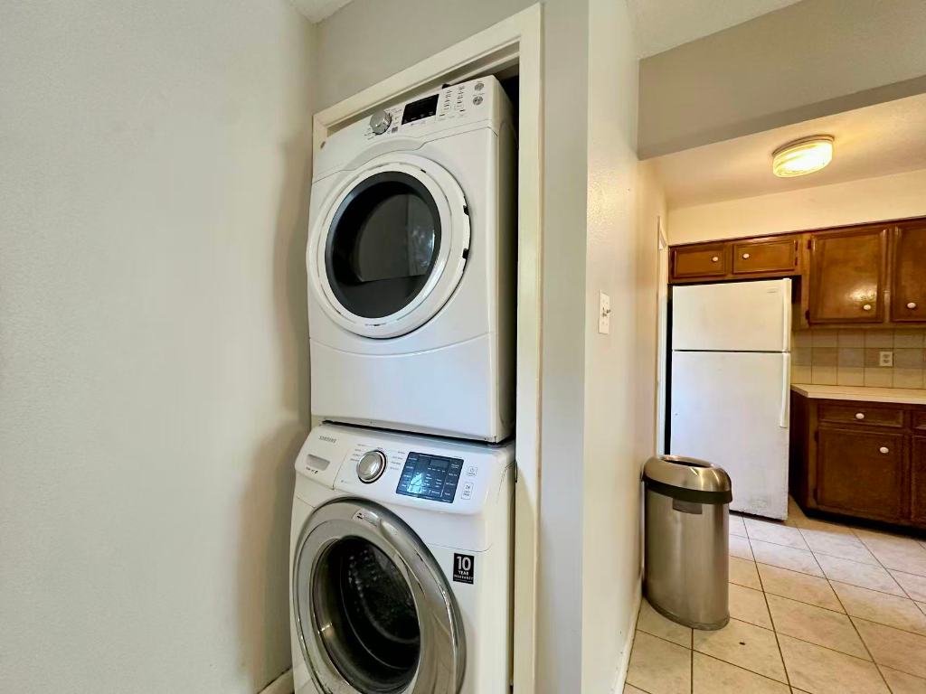 202 2nd Street North, Unit D Pflugerville, TX 78660 - Photo 13 of 15 a view of a kitchen with washer and dryer