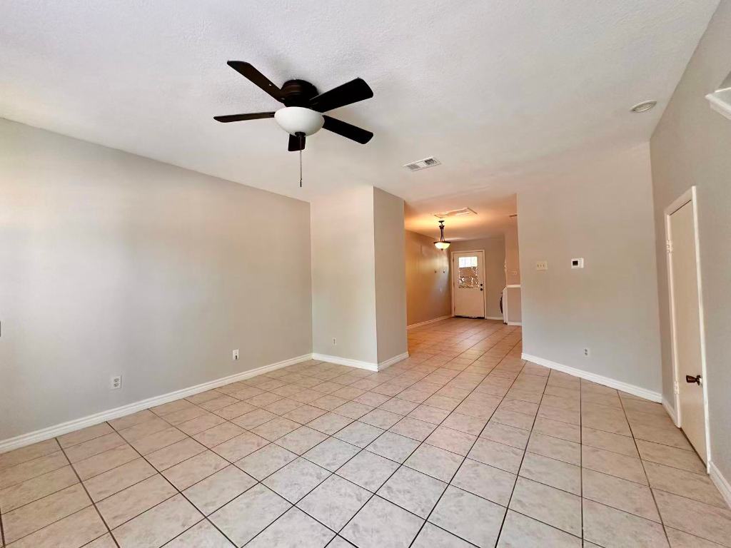 202 2nd Street North, Unit D Pflugerville, TX 78660 - Photo 2 of 15 a view of an empty room and window
