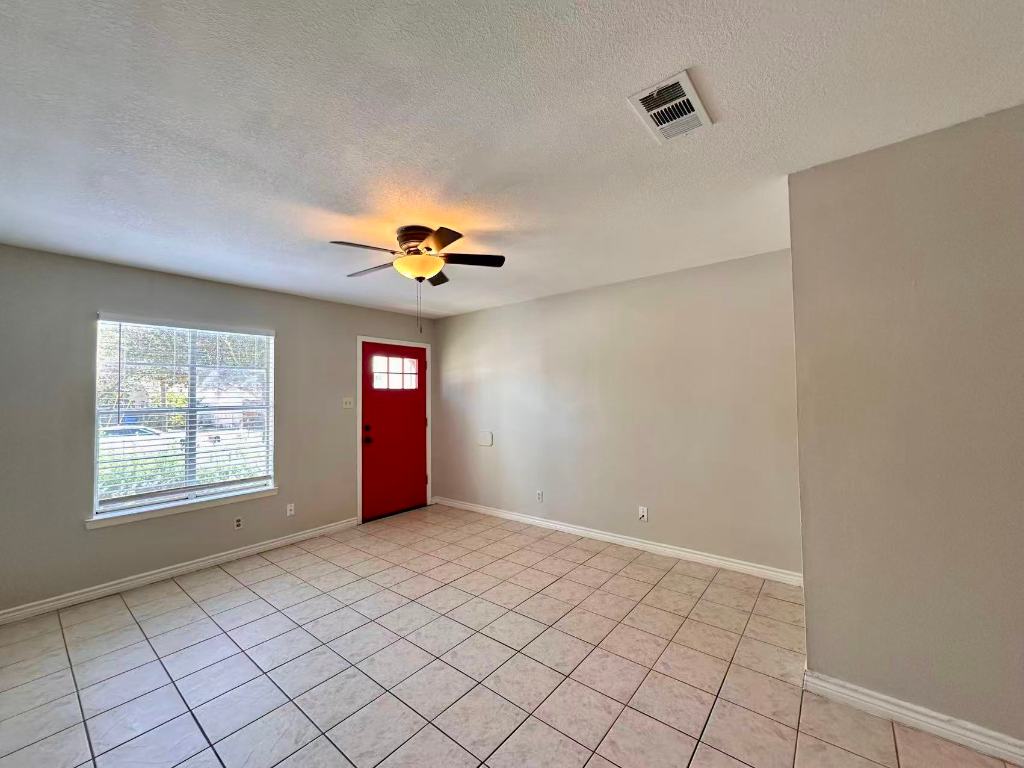 202 2nd Street North, Unit D Pflugerville, TX 78660 - Photo 3 of 15 a view of an empty room with a window