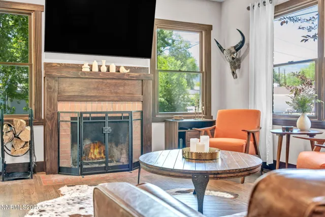 a bedroom with a large bed and a large window