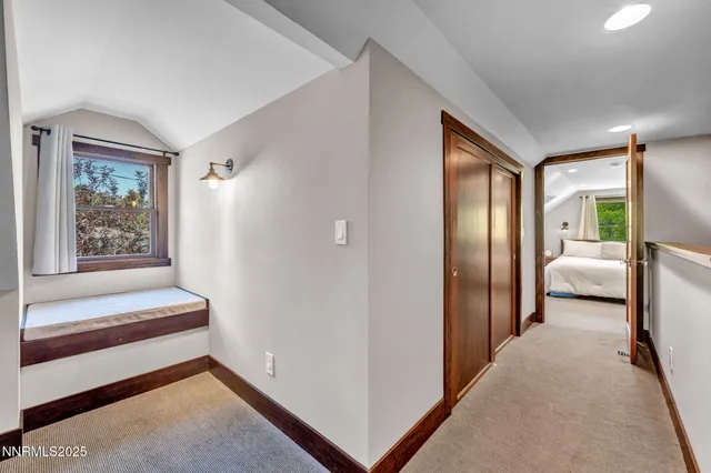 a work room with furniture and a window