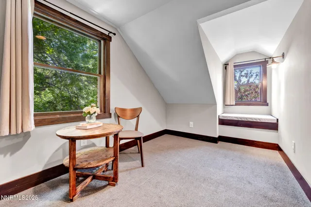 a view of a living room and dining area