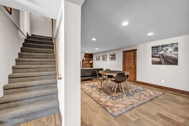 a living room with furniture and a rug