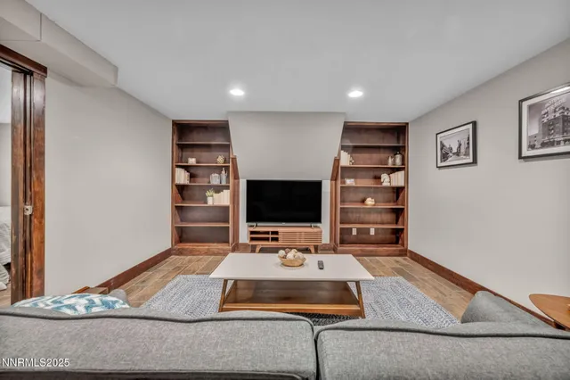 a room with a table chairs and a stove