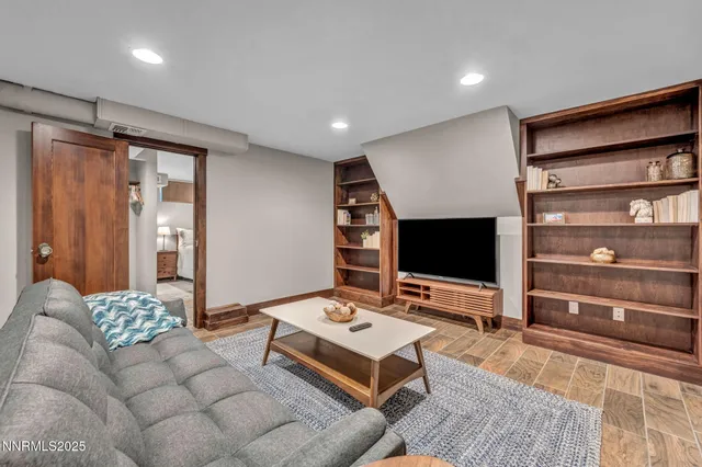 a bedroom with a bed and a view of room