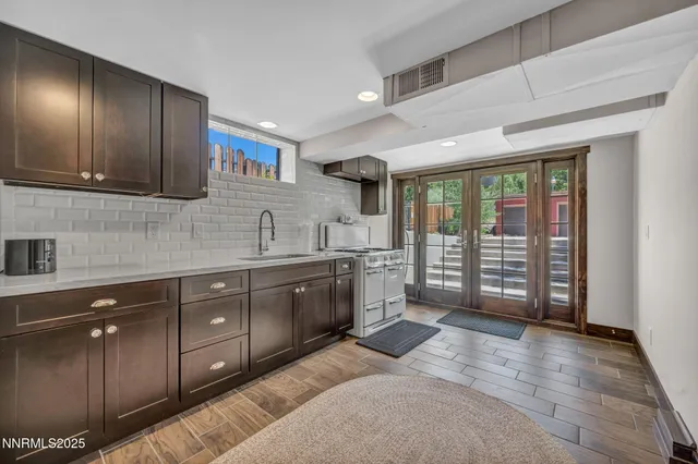 a view of a garden with a tree in front of it