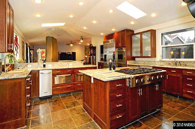 1665 Wendy Way Reno, NV 89509 - Photo 3 of 9 a kitchen with a stove sink and cabinets