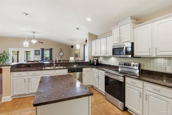 a kitchen with a sink and cabinets
