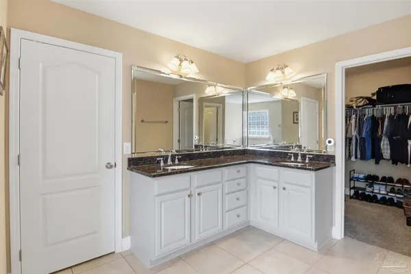 a white bath tub sitting next to a window