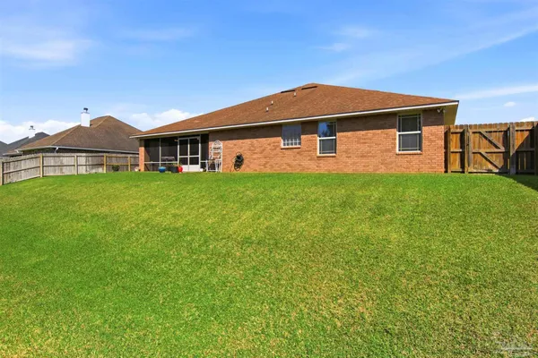 a view of a yard with a trampoline