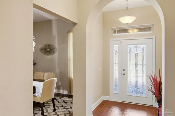 a view of a room with wooden floor and a bathroom sink