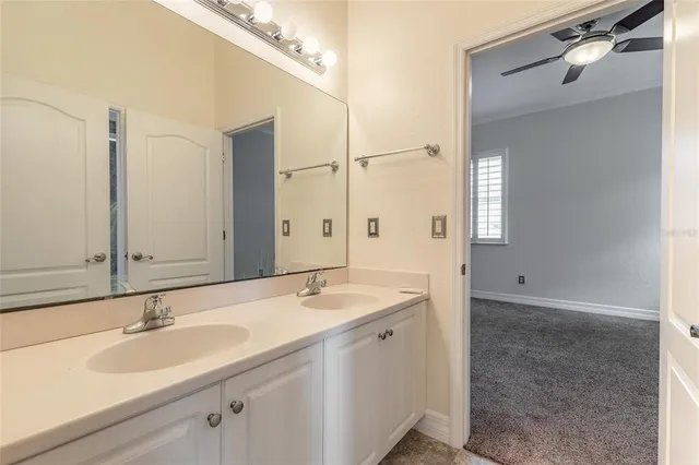 a view of empty room with ceiling fan