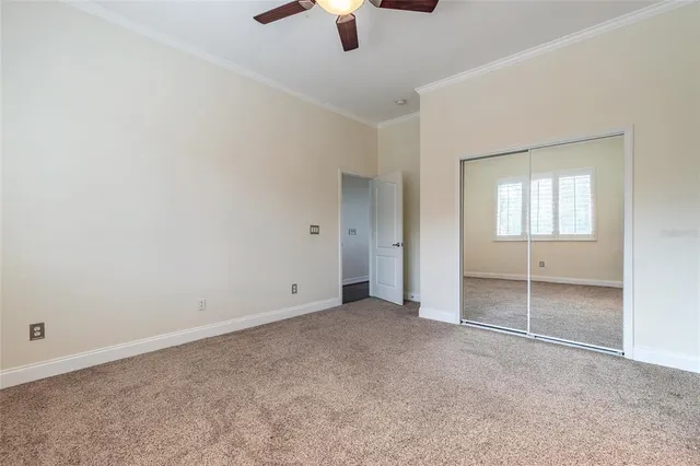 a spacious bathroom with a double vanity sink a mirror and a bathtub