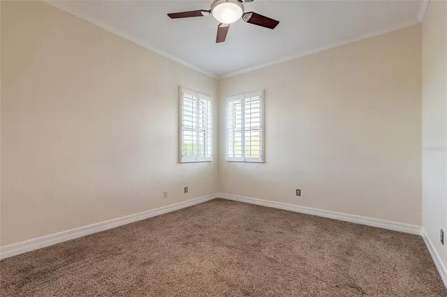 a bathroom with a granite countertop toilet and a sink