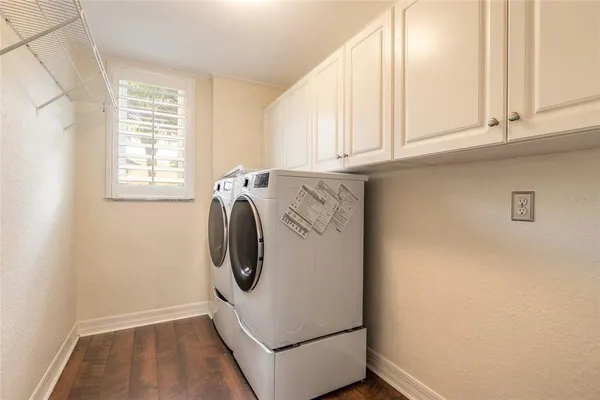 an aerial view of a house with a lake view