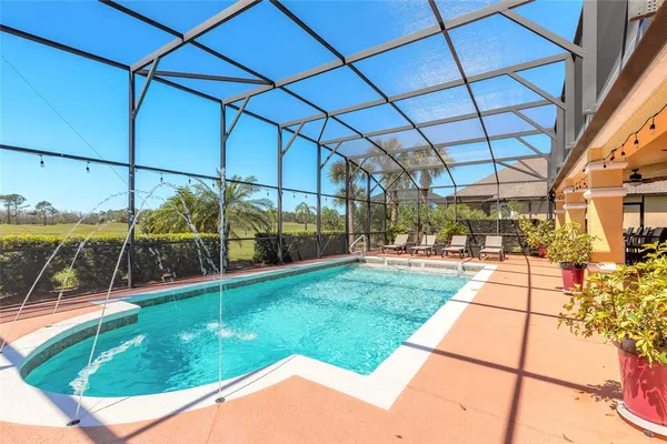 a view of a livingroom with furniture and a ceiling fan