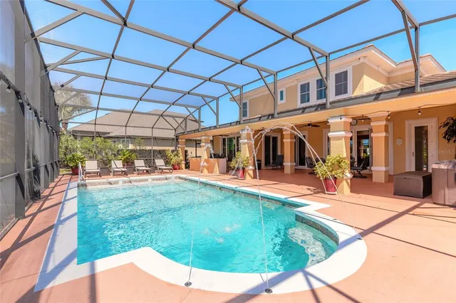 a dining room with furniture and a floor to ceiling window