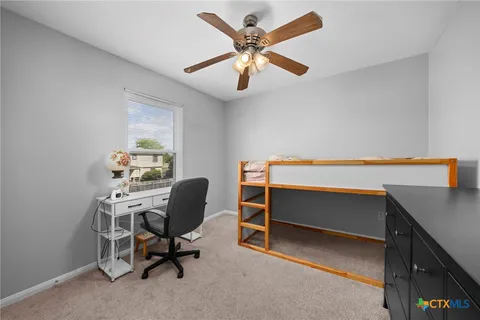 a view of a workspace with furniture