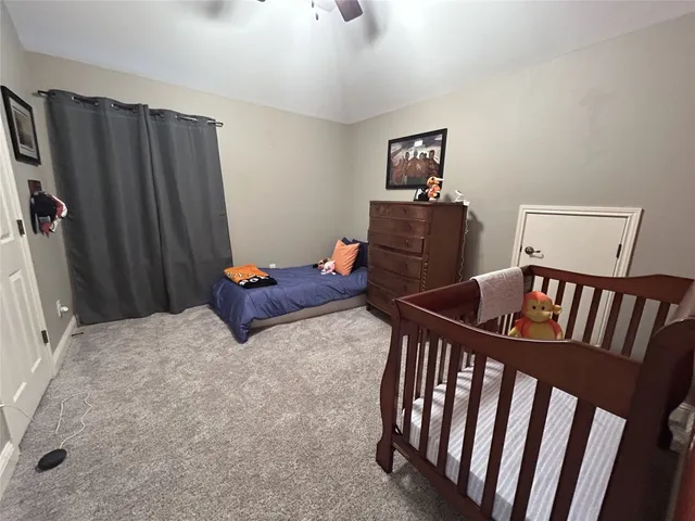 a bedroom with furniture and wooden floor