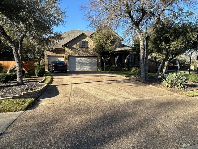 a view of a house with a yard covered with snow in front of it