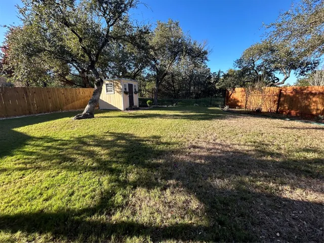 a backyard of a house with lots of green space