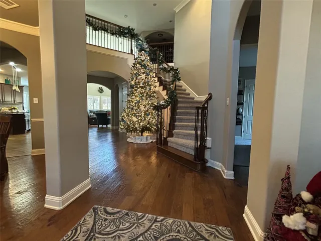 a view of entryway with wooden floor