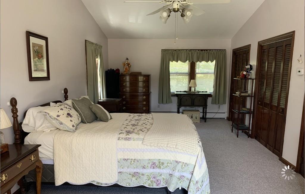 1225 Reed Road Dartmouth, MA 02747 - Photo 13 of 21 a bed sitting in a bedroom next to a window