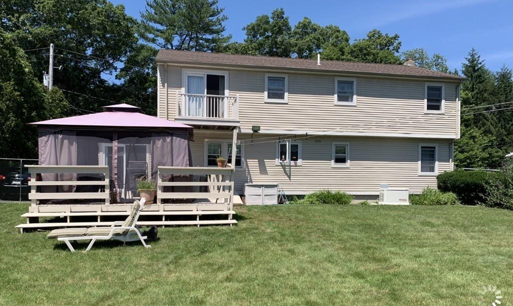 1225 Reed Road Dartmouth, MA 02747 - Photo 18 of 21 a front view of a house with a yard