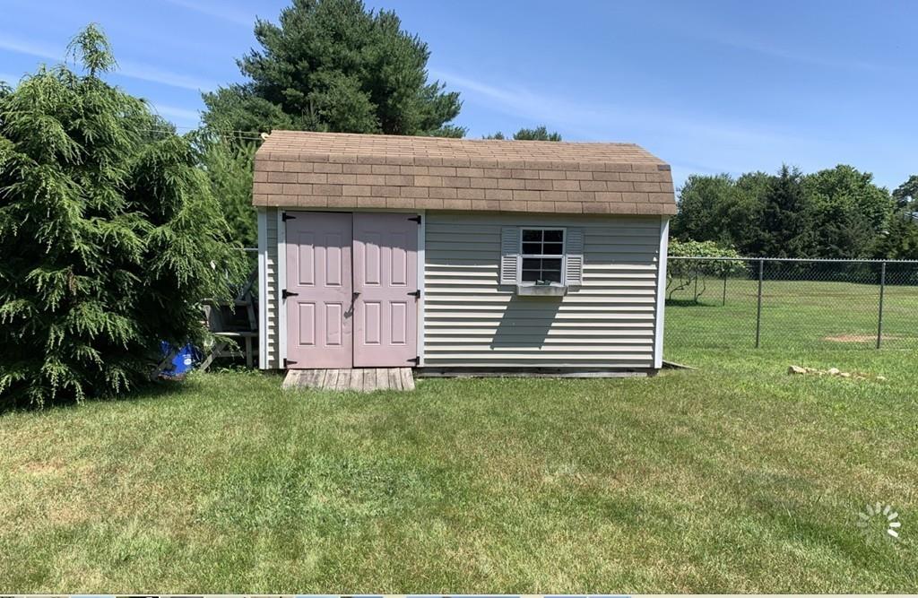 1225 Reed Road Dartmouth, MA 02747 - Photo 19 of 21 a view of a house with a yard