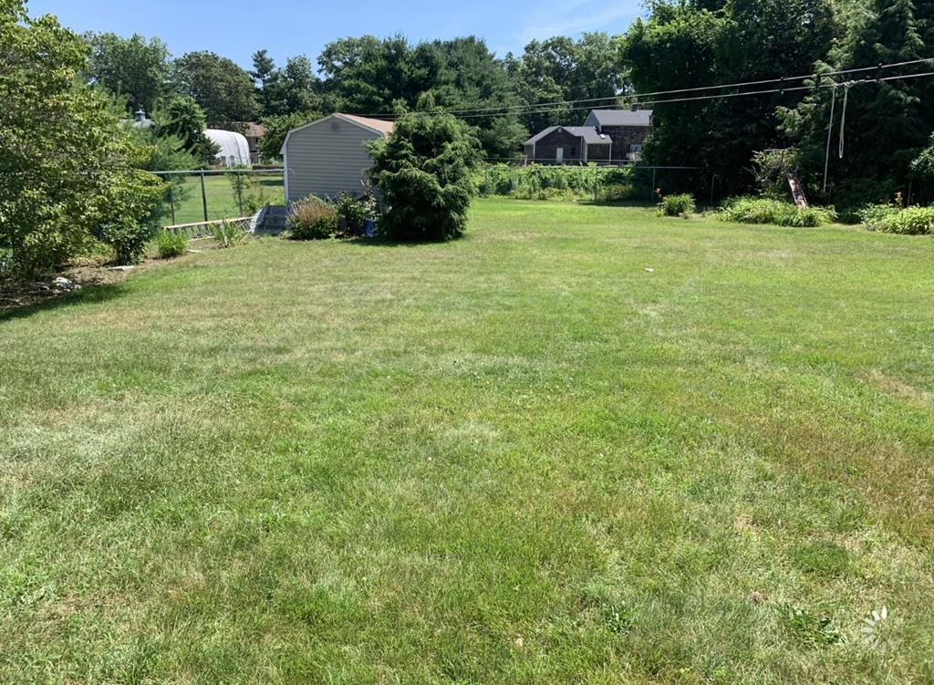 1225 Reed Road Dartmouth, MA 02747 - Photo 21 of 21 a backyard of a house with trampoline