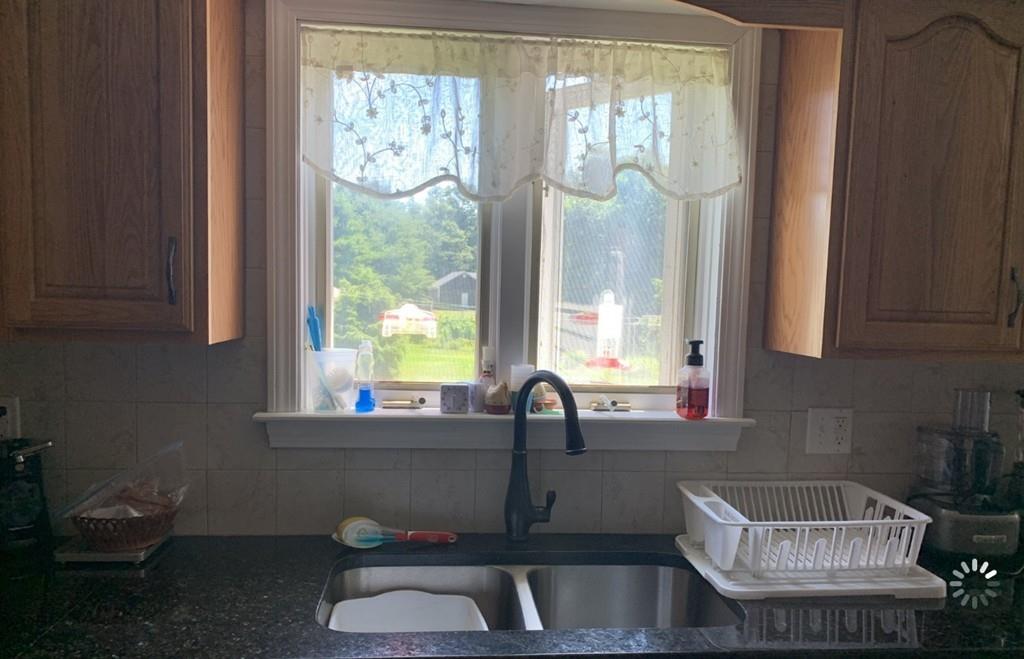 1225 Reed Road Dartmouth, MA 02747 - Photo 3 of 21 a kitchen with a sink and a window