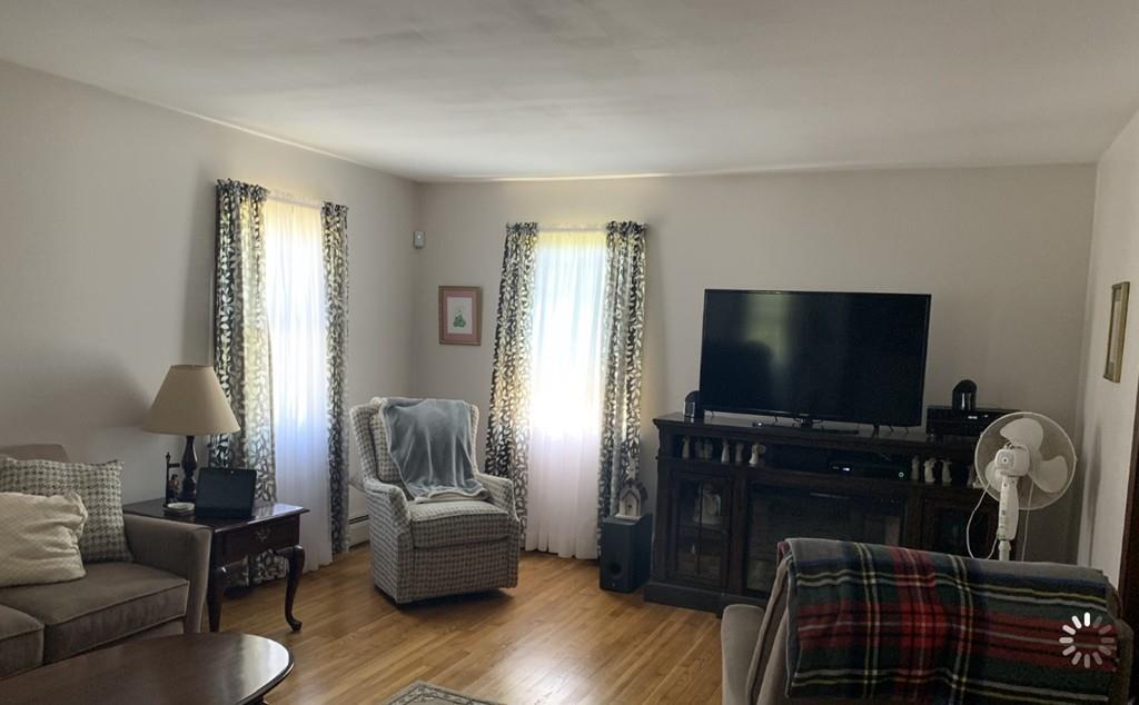 1225 Reed Road Dartmouth, MA 02747 - Photo 9 of 21 a living room with furniture and a flat screen tv